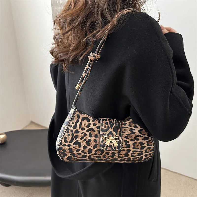 Large capacity casual women handbag in PU material with sandwich pocket design shown in black brown coffee and khaki colours