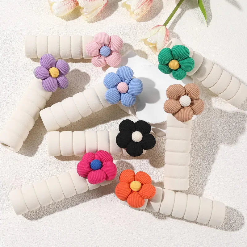 Soft round floral door handle protective cover in PEVA material on a door.