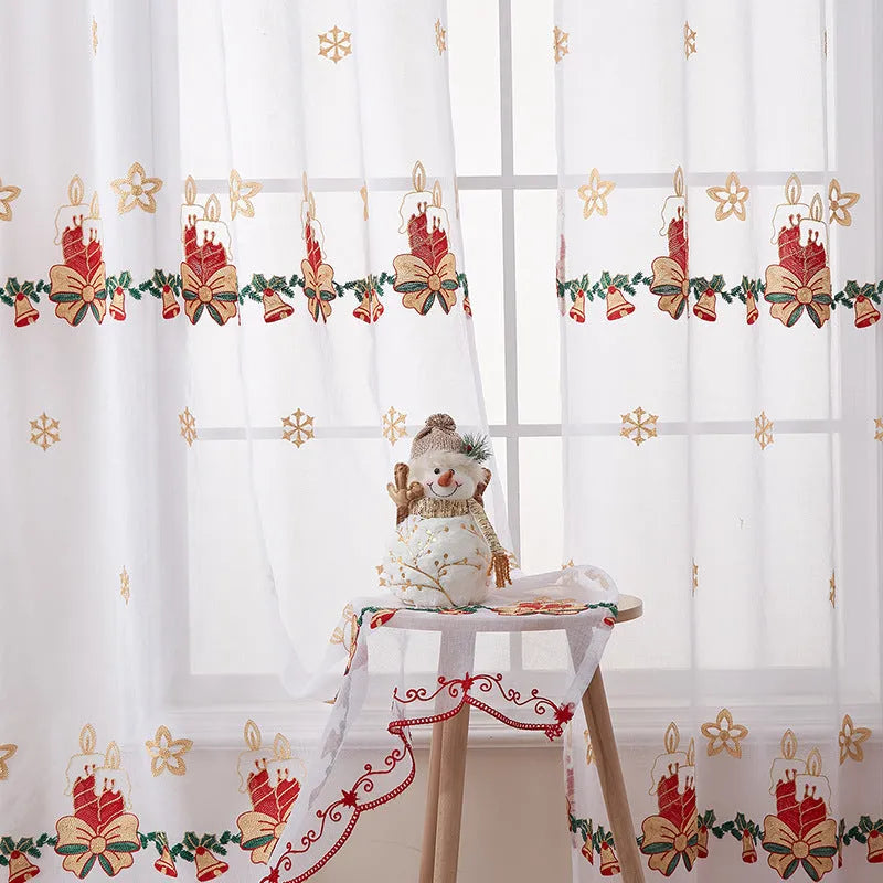 White Christmas curtain with embroidered blue snowflake pattern showing textured embroidery detail