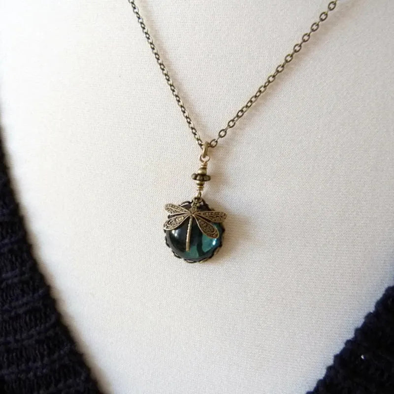 Hand carved dragonfly pendant necklace with vintage bronze appearance and 925 silver setting
