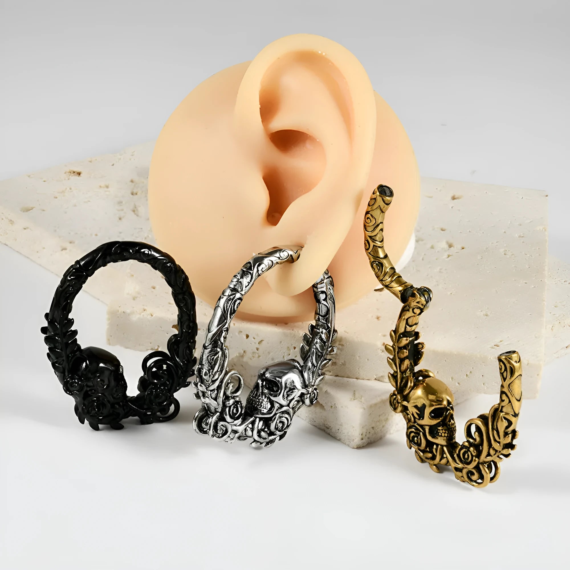 Fashion stainless steel earrings with a shaped totem pattern in an electroplated colour finish.
