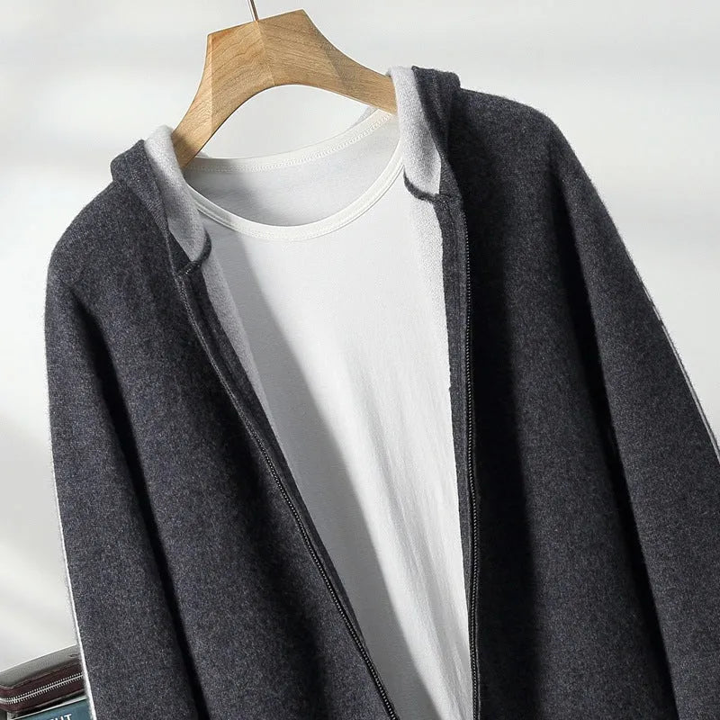 Man wearing a dark blue zip-front cashmere cardigan with a half-high collar and loose fit.