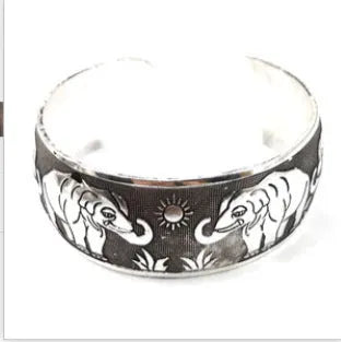 Ethnic carved open bracelet with Miao silver style in turtle colour showing Roman-inspired shape