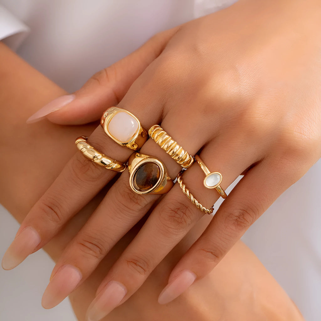 Set of six light gold geometric alloy rings with irregular shapes and electroplated finish