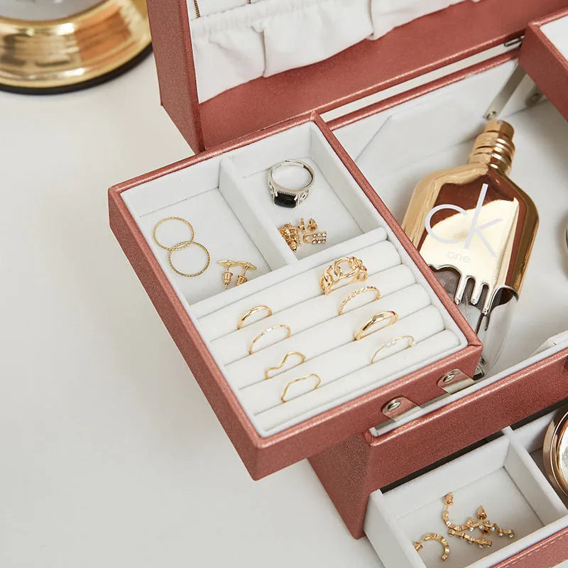 Hard leather jewellery storage box in beige, black, pink, or rose gold, showing its rectangular shape and compact size