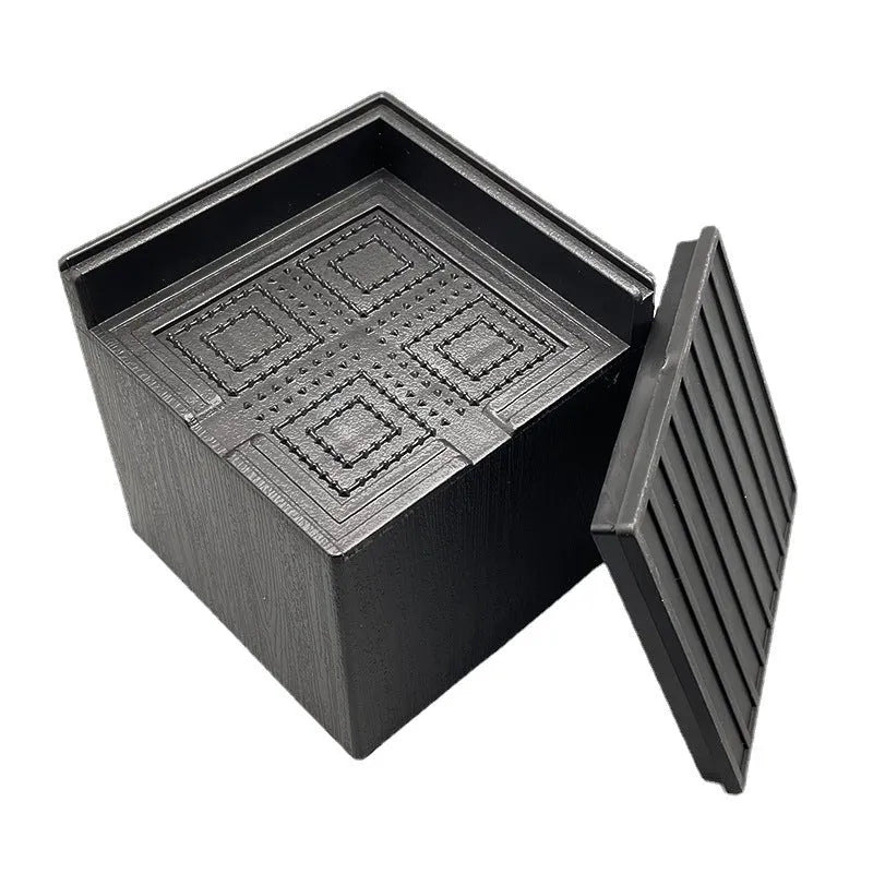 Four black plastic bed risers for raising furniture height with thickened support mats