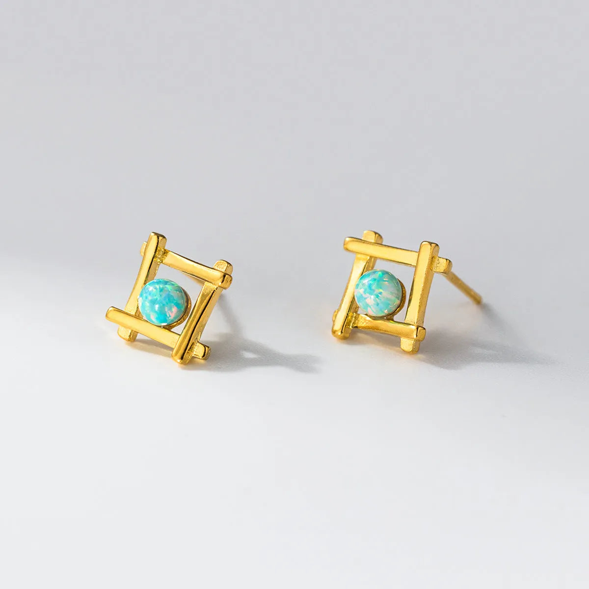 Women's geometric cross quadrangle stud earrings in 925 silver with silver or gold tone finishes