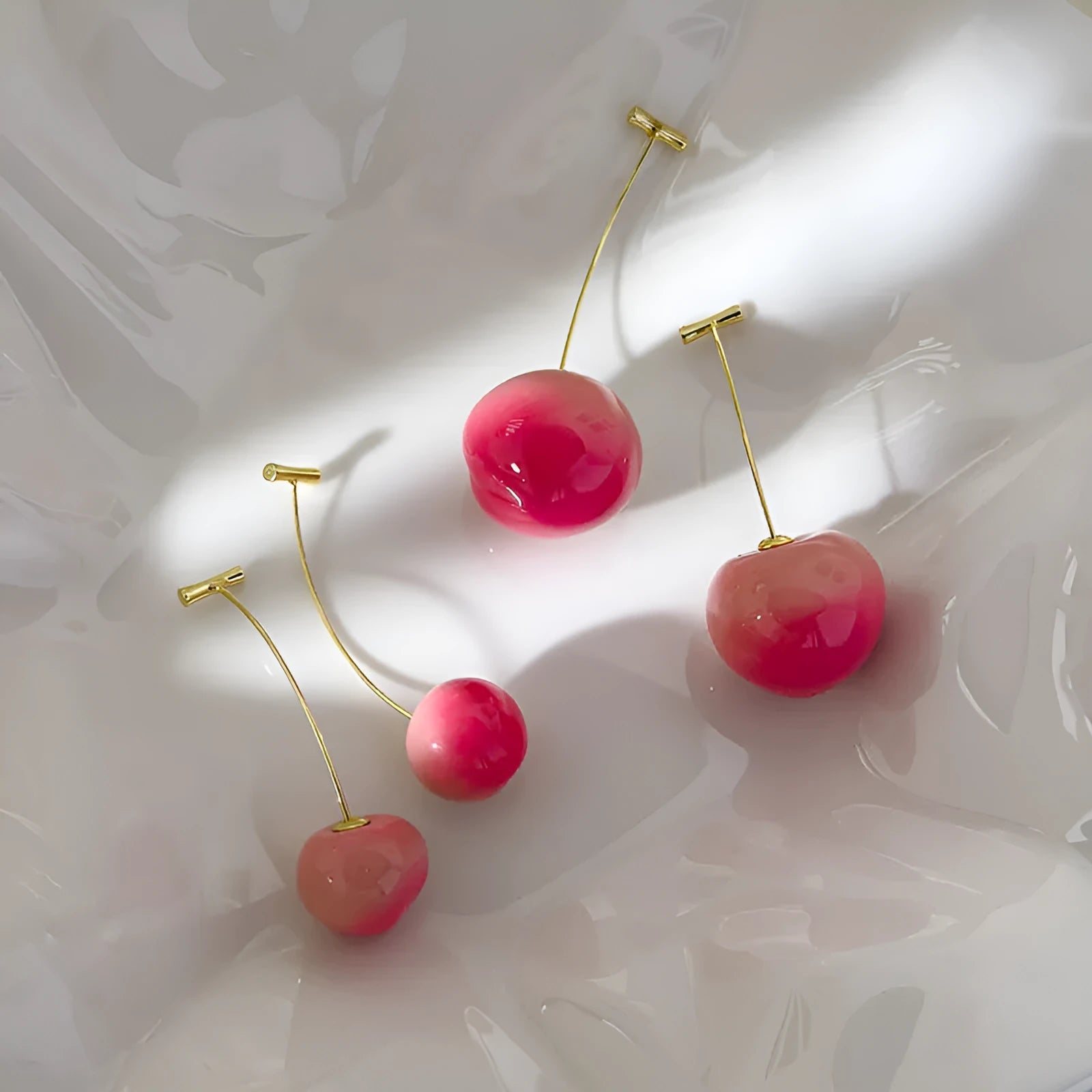 Small and large acrylic peach fruit earrings with copper hooks showing realistic peach detailing