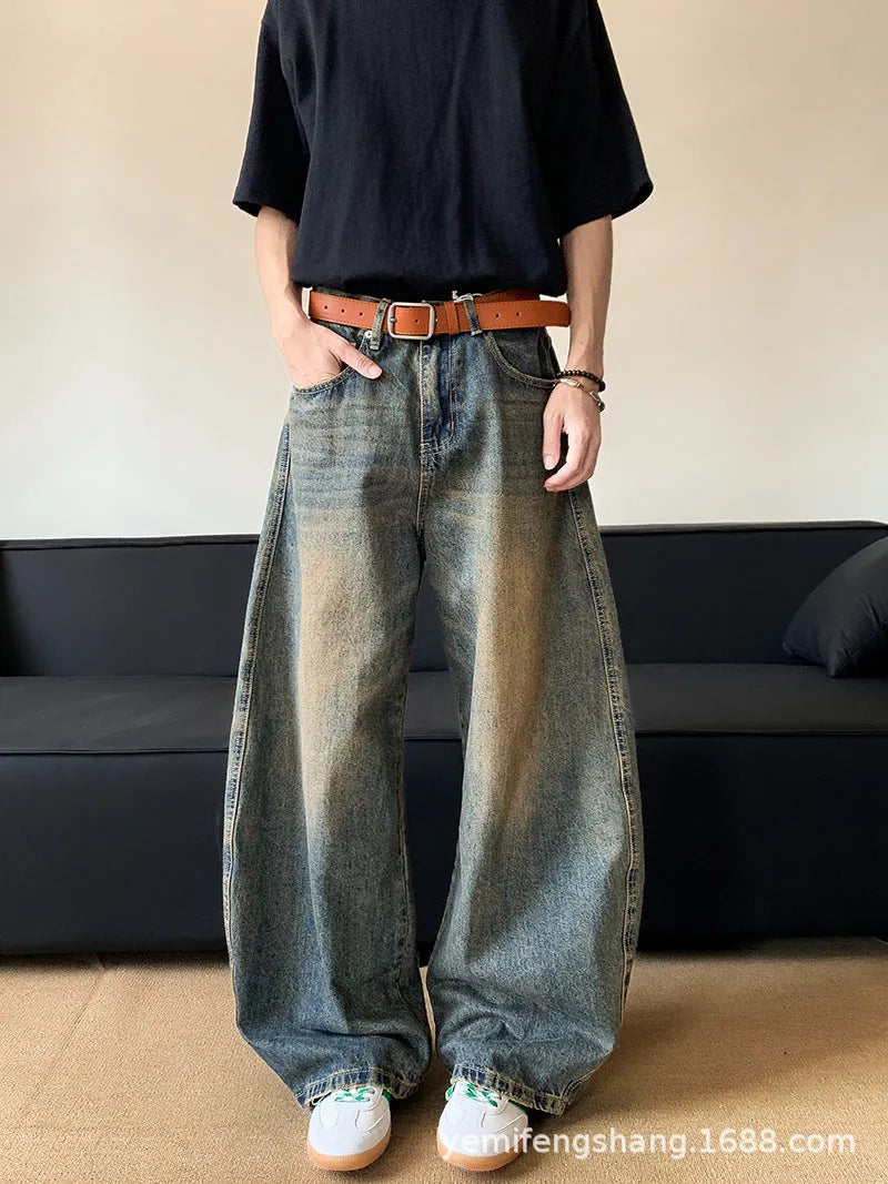 Men's retro blue distressed denim jeans with a wide-leg slim fit and micro elasticity.