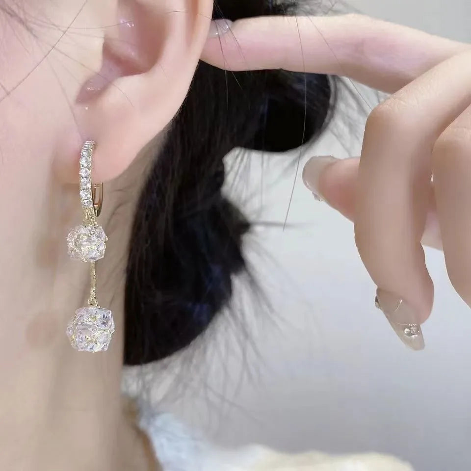 Silver-colour women's clip-on earrings with a confession balloon design, rhinestone ball, and double tassel pendant.