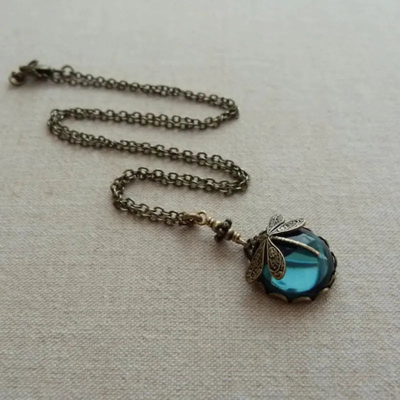 Hand carved dragonfly pendant necklace with vintage bronze appearance and 925 silver setting