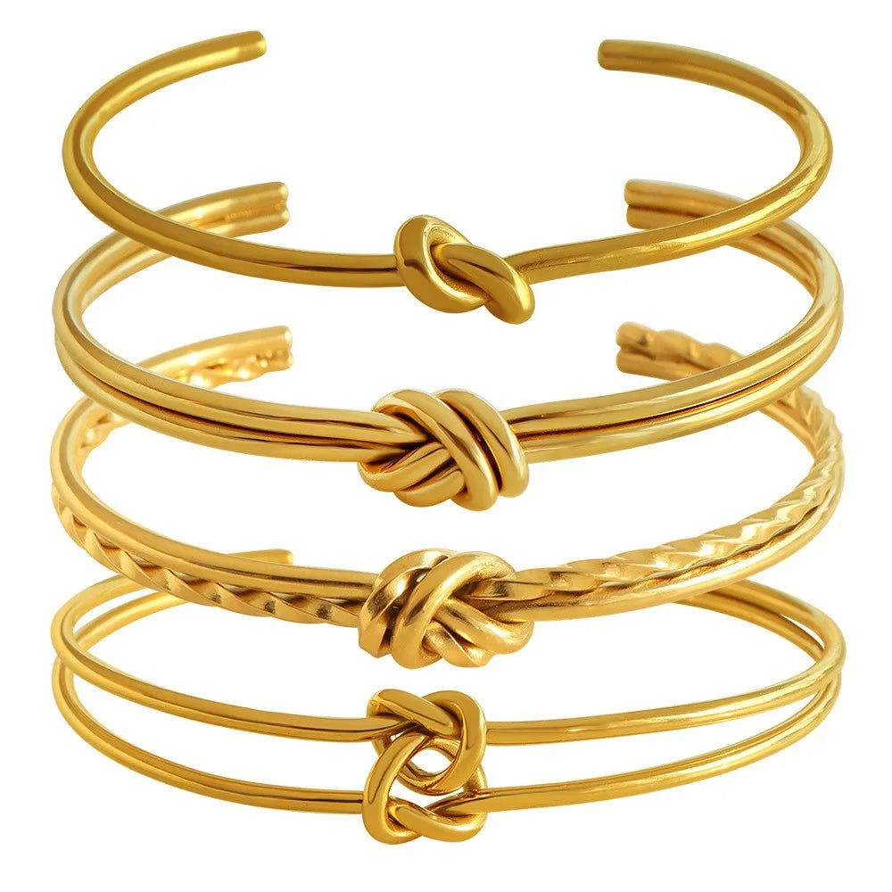 Gold or silver adjustable women's bracelet with knotted C-shaped open design and double layers.