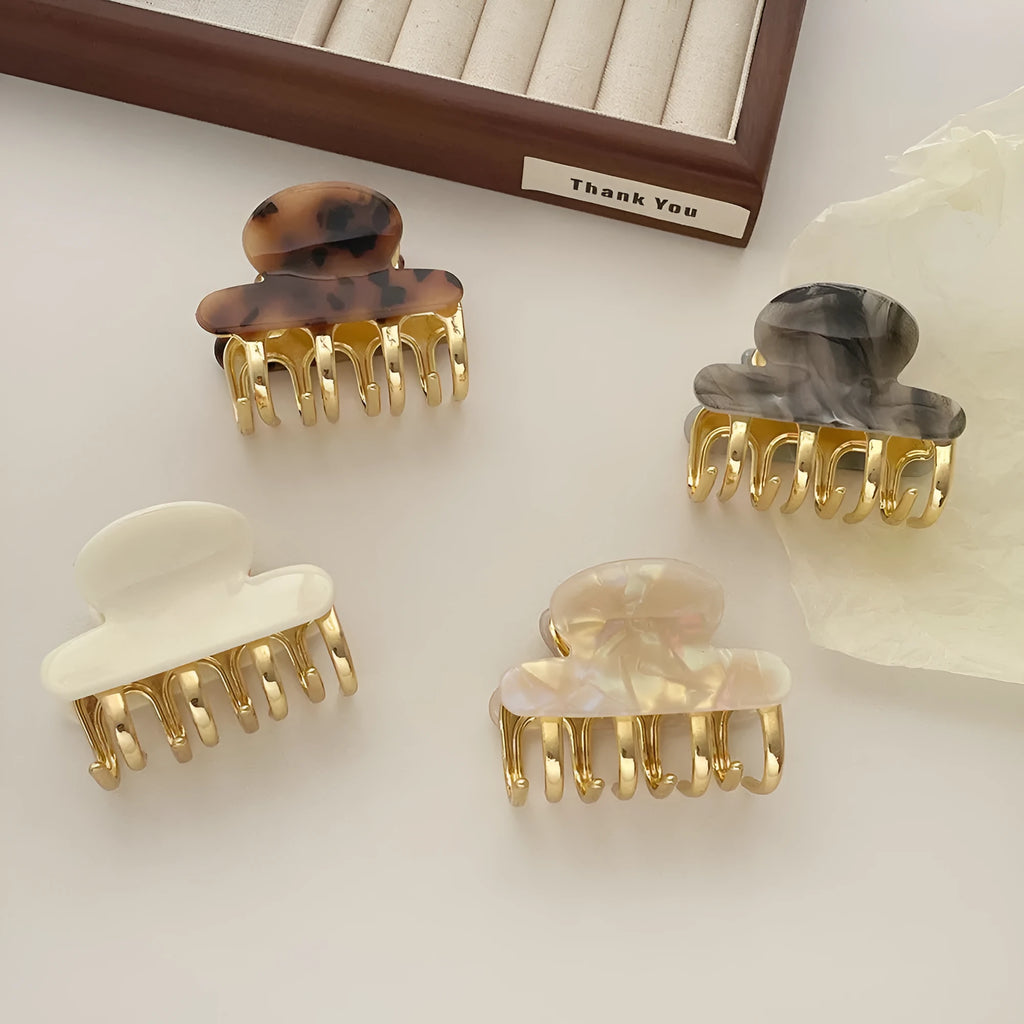 Dopamine retro acetate hair barrette with a metal grip in a medium size, shown in beige colour.