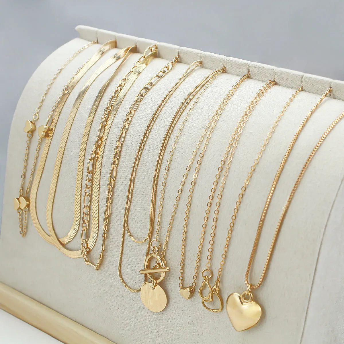 Gold women's necklace set of 10 pieces with snake bone chains and adjustable length