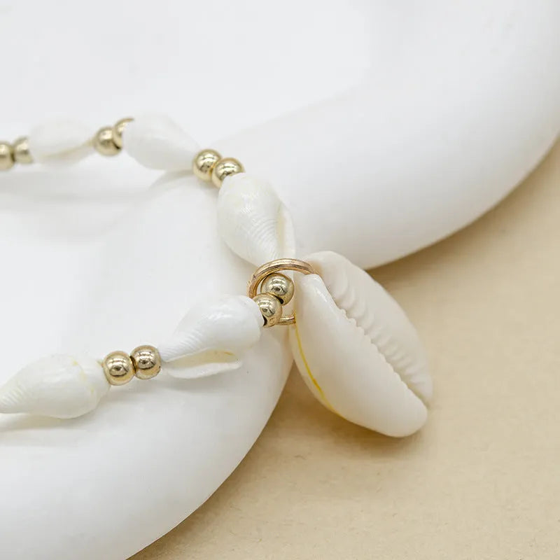 White conch shell bead necklace with mother of pearl pendant on regular chain