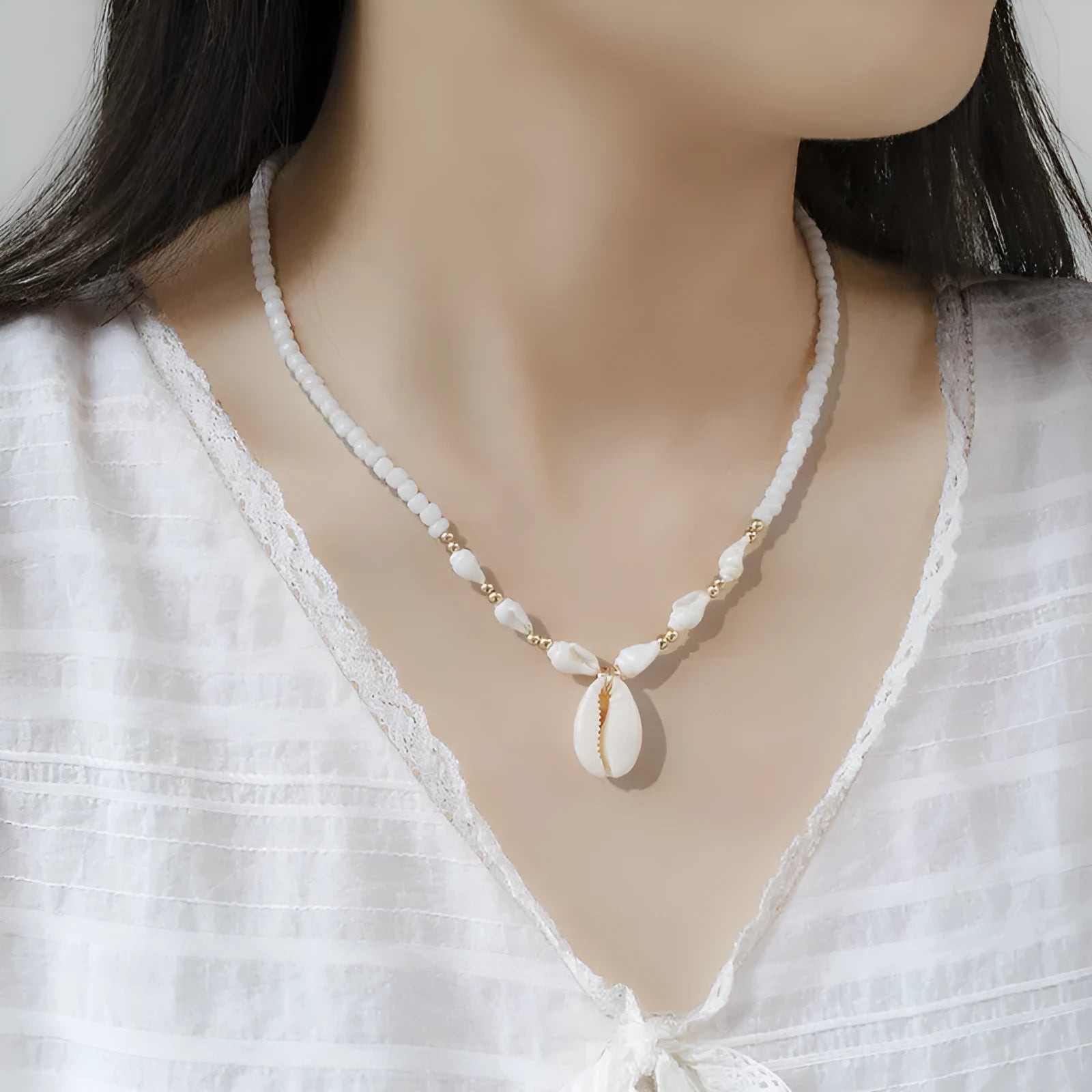 White conch shell bead necklace with mother of pearl pendant on regular chain
