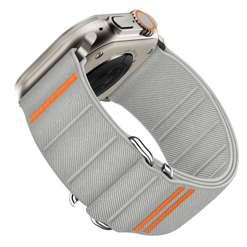 Elastic nylon Apple Watch band with stainless steel buckle shown in multiple colour options.
