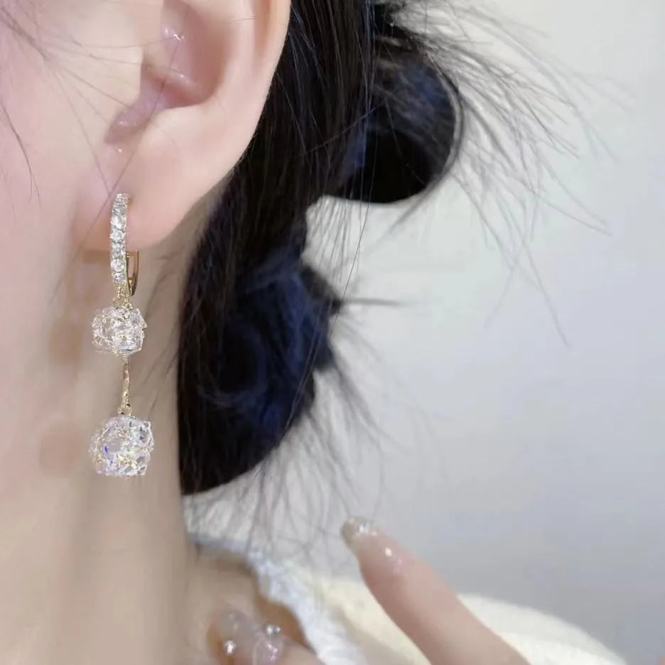 Silver-colour women's clip-on earrings with a confession balloon design, rhinestone ball, and double tassel pendant.