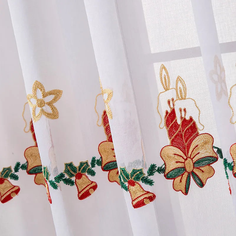 White Christmas curtain with embroidered blue snowflake pattern showing textured embroidery detail
