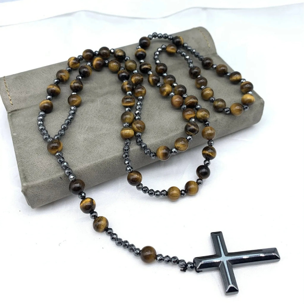 Men's hand-woven stone cross pendant necklace on a ball bead chain with safety lock clasp.