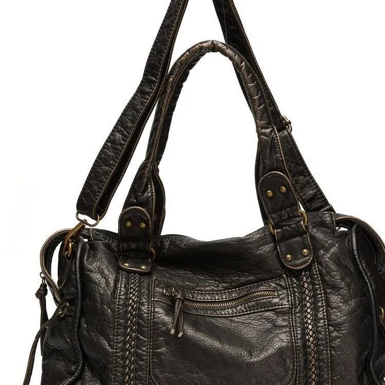 Women's brown French retro motorcycle messenger bag with woven decoration and shoulder strap