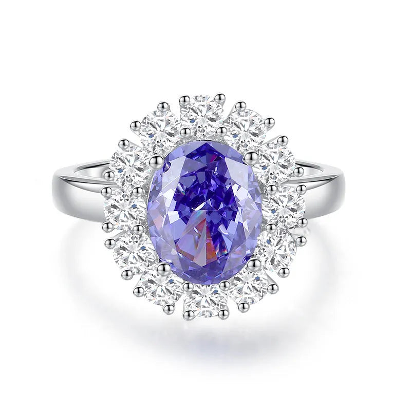Heart-shaped 925 sterling silver ring with a sparkling ice flower cut colour zircon stone on a finger.