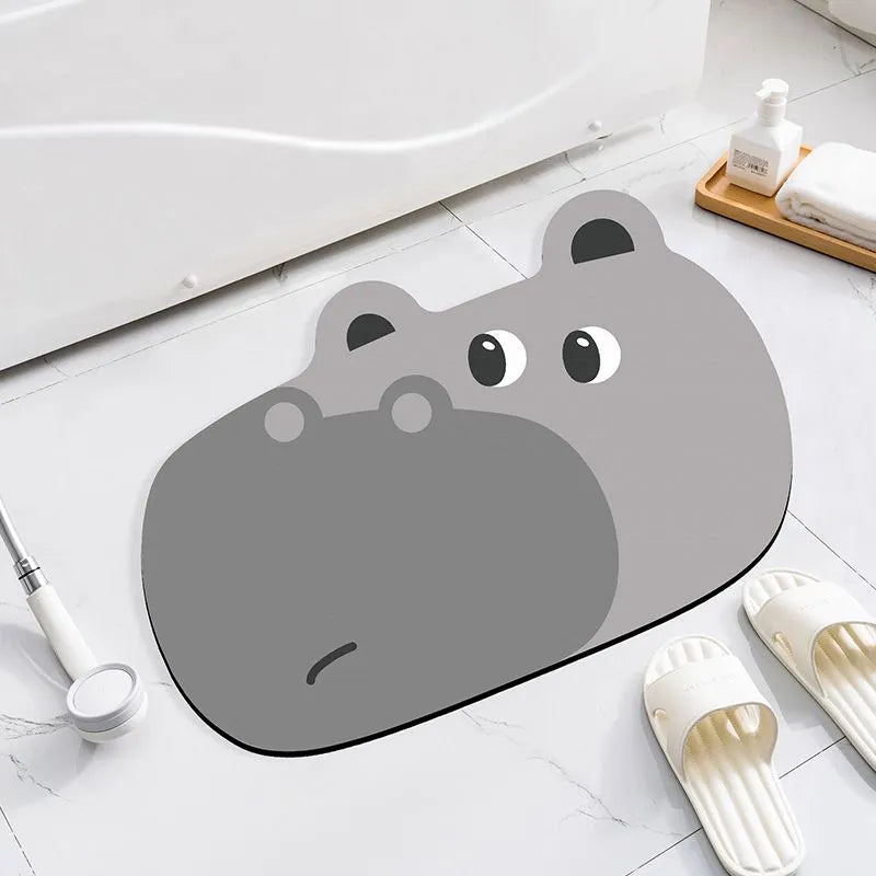 Colourful cartoon animal diatomaceous earth bathroom mat on tiles, showing non-slip base and absorbent texture.