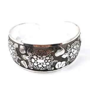 Ethnic carved open bracelet with Miao silver style in turtle colour showing Roman-inspired shape