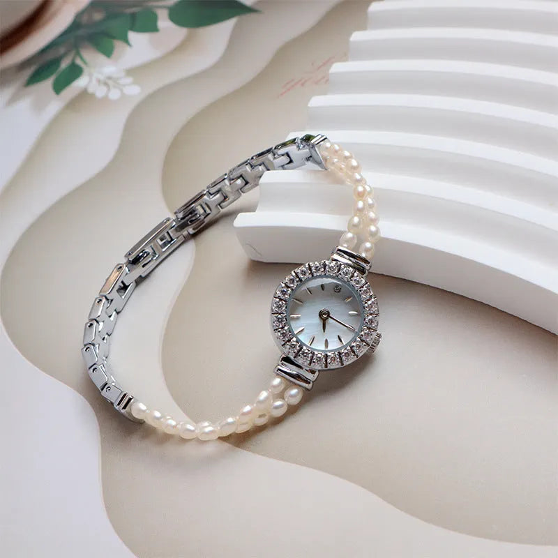 Women's light gold bracelet watch with natural freshwater pearls and 18mm round dial