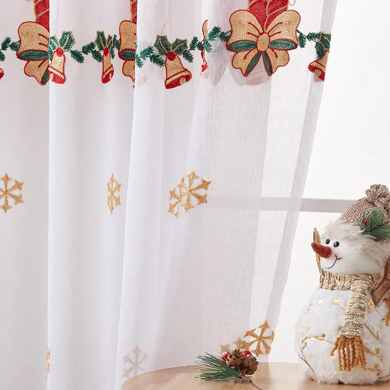 White Christmas curtain with embroidered blue snowflake pattern showing textured embroidery detail