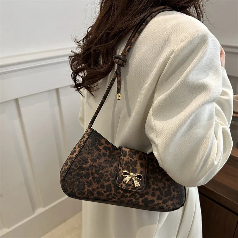 Large capacity casual women handbag in PU material with sandwich pocket design shown in black brown coffee and khaki colours