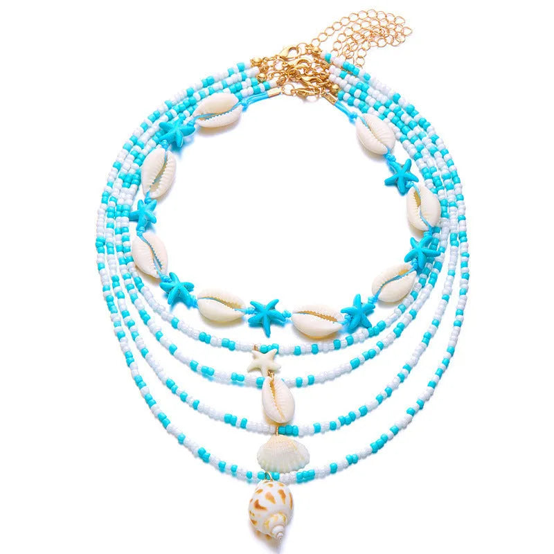 Women's multi-layer necklace set with starfish, shell and conch bead pendants in blue