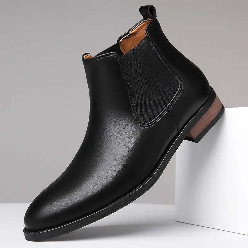 Men's black Chelsea boots with pointed toe and artificial PU leather upper on rubber sole