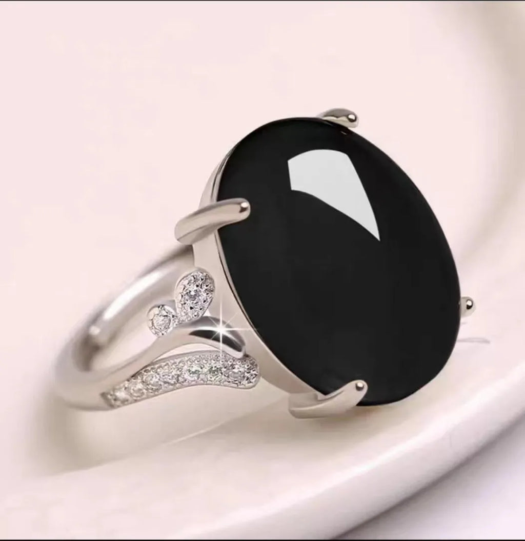 Geometric ethnic-style adjustable ring with a sapphire element in alloy, shown in multiple colours.