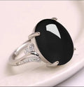 Geometric ethnic-style adjustable ring with a sapphire element in alloy, shown in multiple colours.