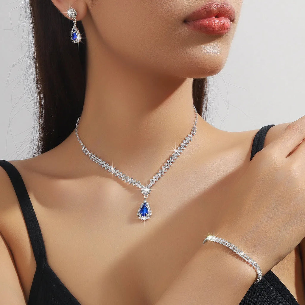 Claw chain necklace and matching earrings set with water drop rhinestone design in multiple colours