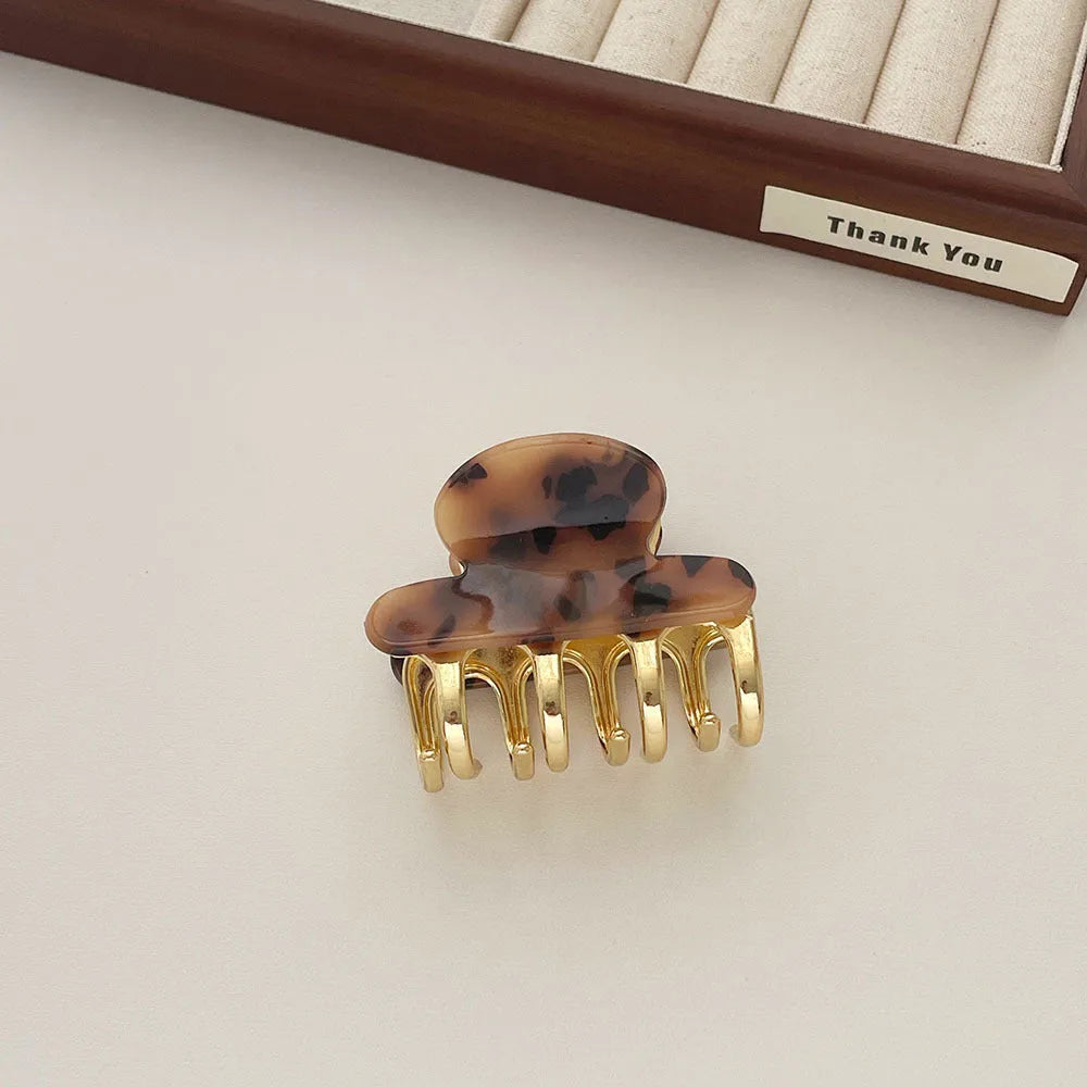Dopamine retro acetate hair barrette with a metal grip in a medium size, shown in beige colour.