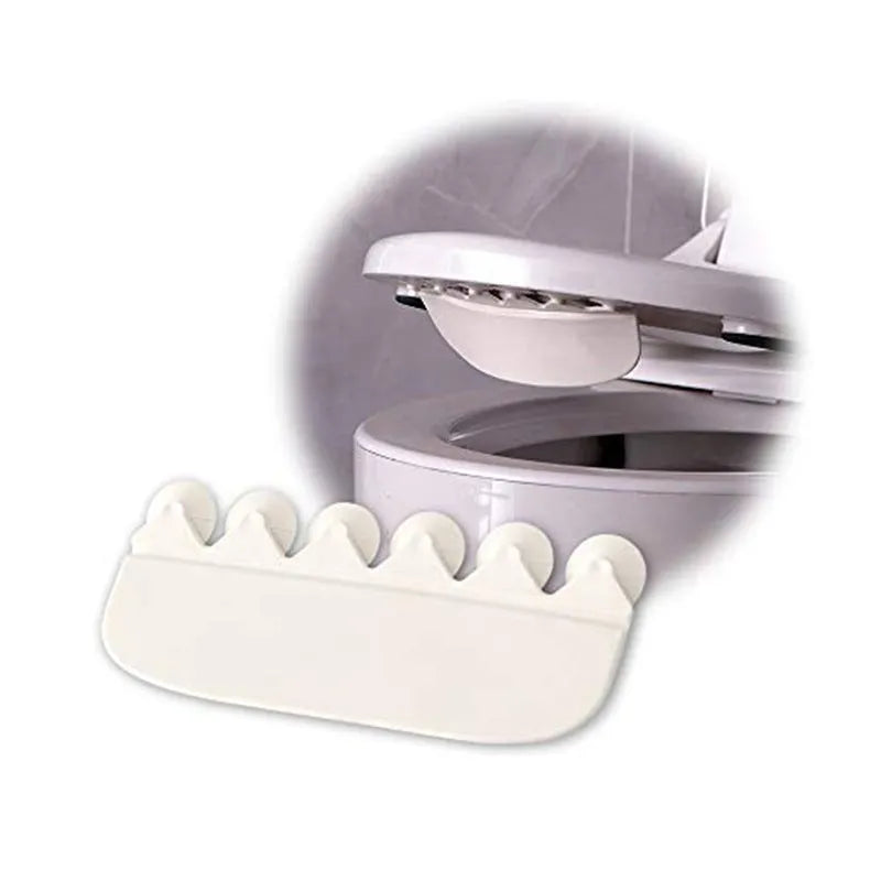 White PVC urine blocking board for children's toilet training placed on toilet