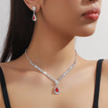 Claw chain necklace and matching earrings set with water drop rhinestone design in multiple colours