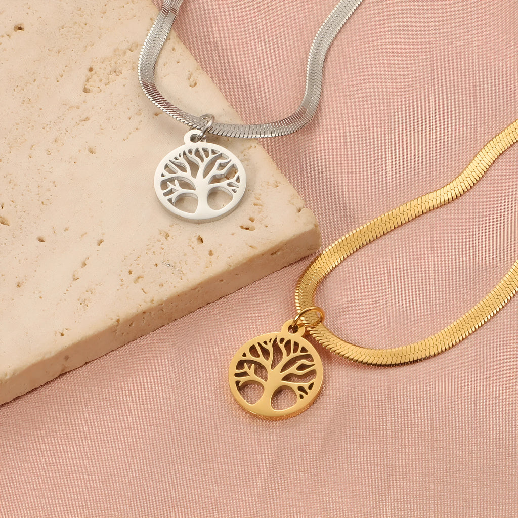 Stainless steel lucky tree necklace on snake bones chain, shown in gold and steel colour finishes.