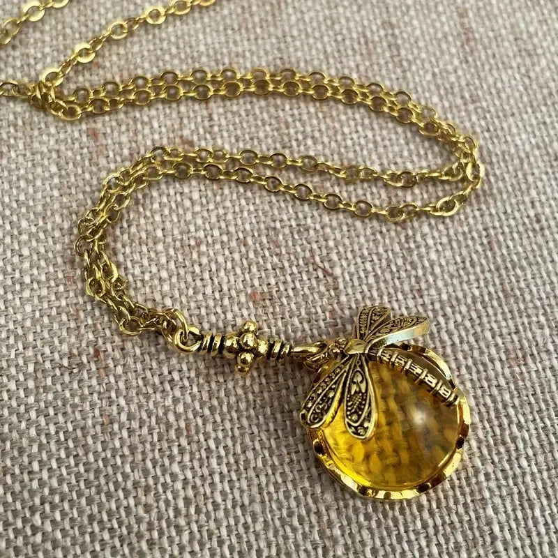 Hand carved dragonfly pendant necklace with vintage bronze appearance and 925 silver setting