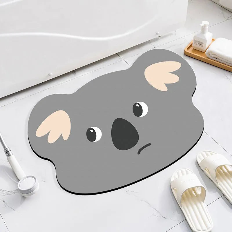 Colourful cartoon animal diatomaceous earth bathroom mat on tiles, showing non-slip base and absorbent texture.