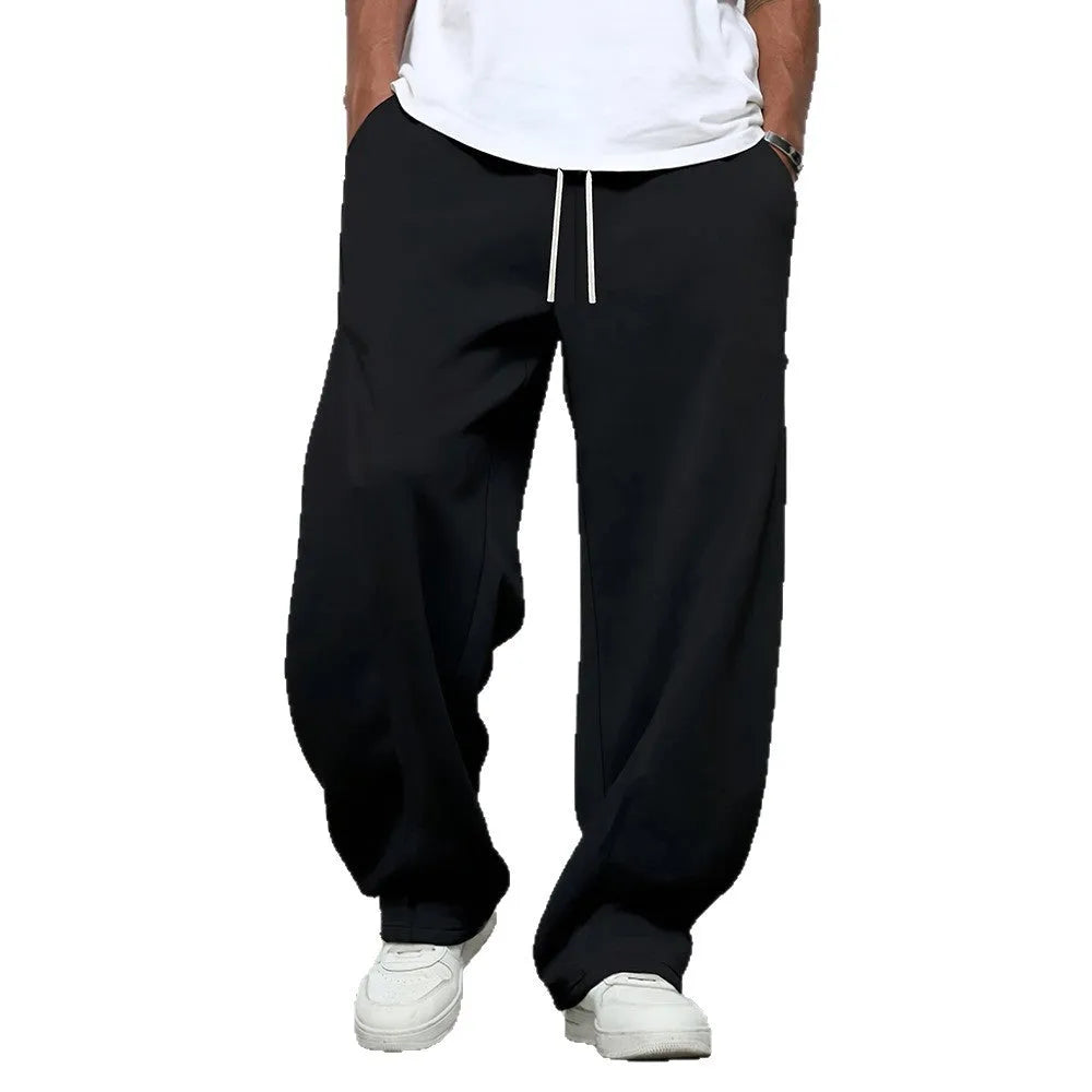 Men's straight-leg casual trousers in polyester fabric with drawstring waist in solid colour options