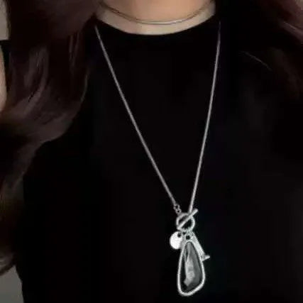 Long geometric pendant sweater chain necklace with snake bones chain in blue, champagne, or grey.
