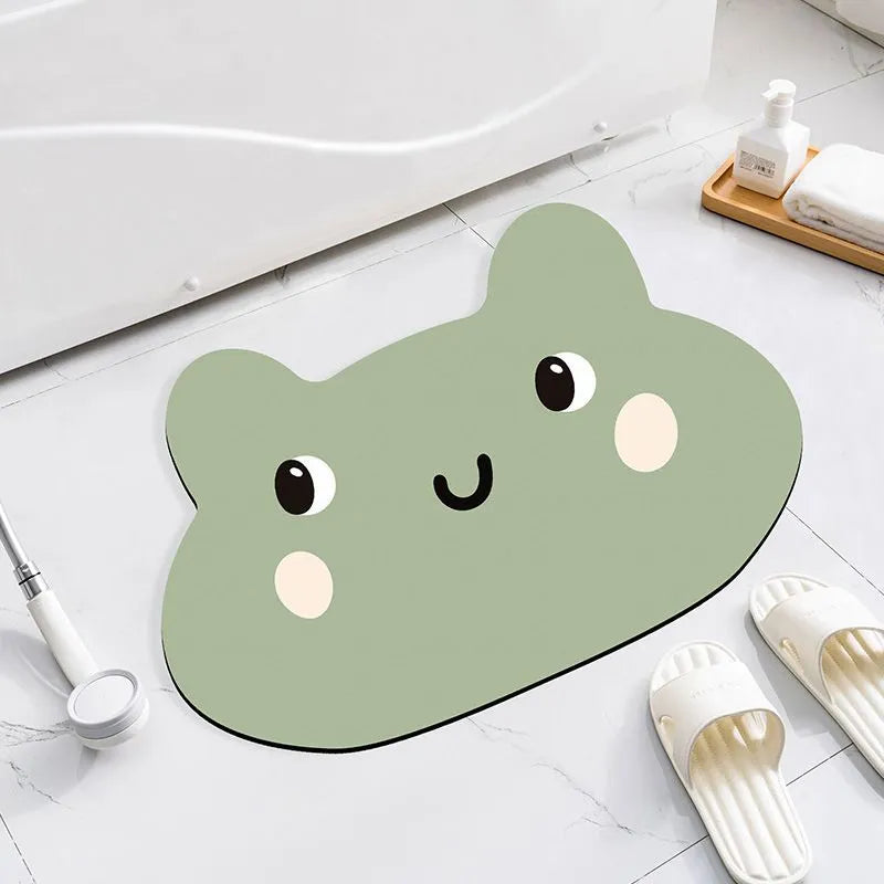 Colourful cartoon animal diatomaceous earth bathroom mat on tiles, showing non-slip base and absorbent texture.