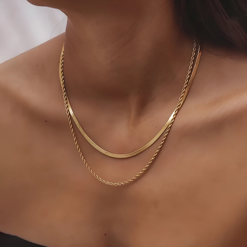 Women's adjustable double-layer twist necklace in stainless steel with geometric titanium steel pendant.
