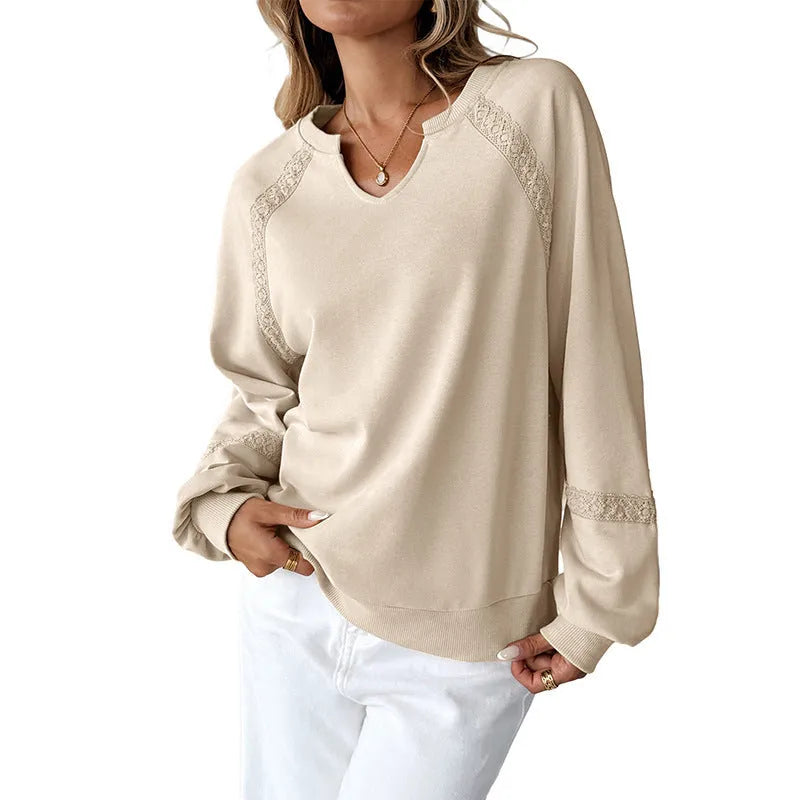 Women's long sleeve sweater with a half-open lace-stitch collar in a solid colour.
