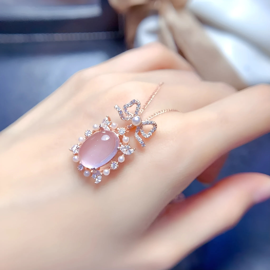 Pink crystal rose quartz pendant with rose gold plated geometric setting on alloy necklace