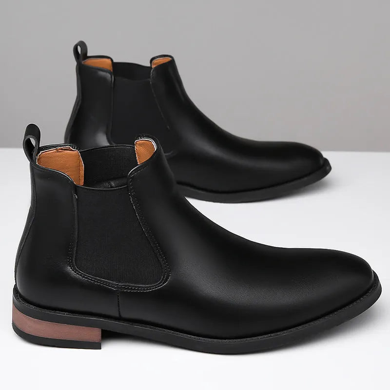 Men's black Chelsea boots with pointed toe and artificial PU leather upper on rubber sole