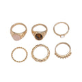 Set of six light gold geometric alloy rings with irregular shapes and electroplated finish